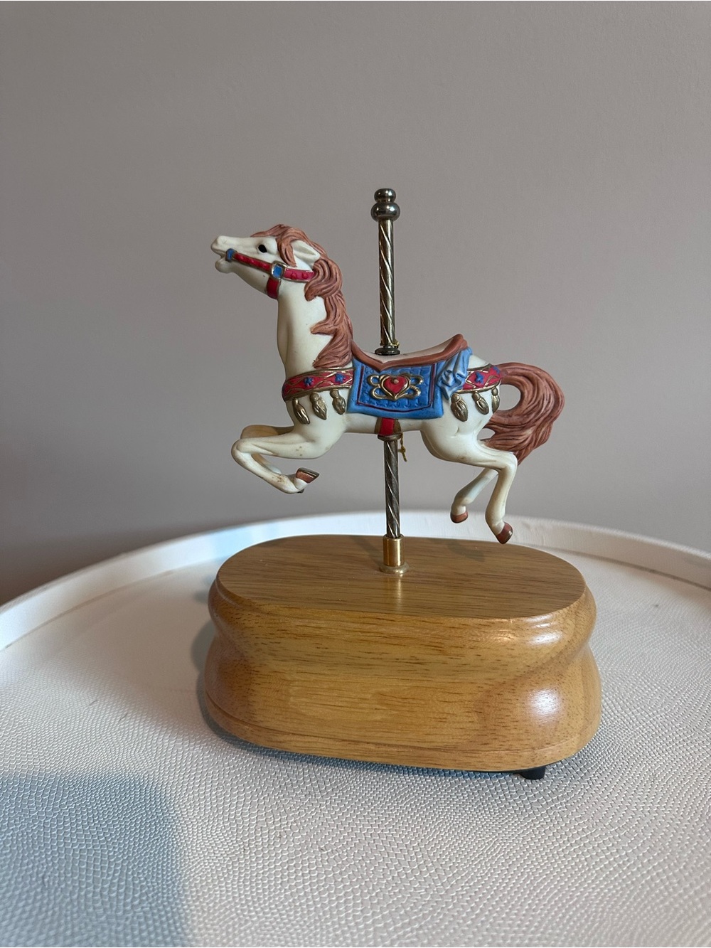 A vintage musical carousel horse figurine